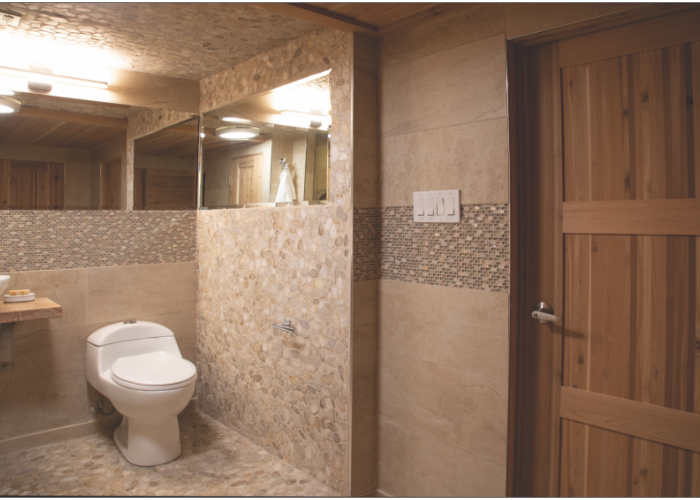 Renovated bathroom with tile on its walls, floors, and ceiling