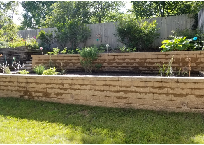 Two-tiered rain garden that has been separated with retaining walls