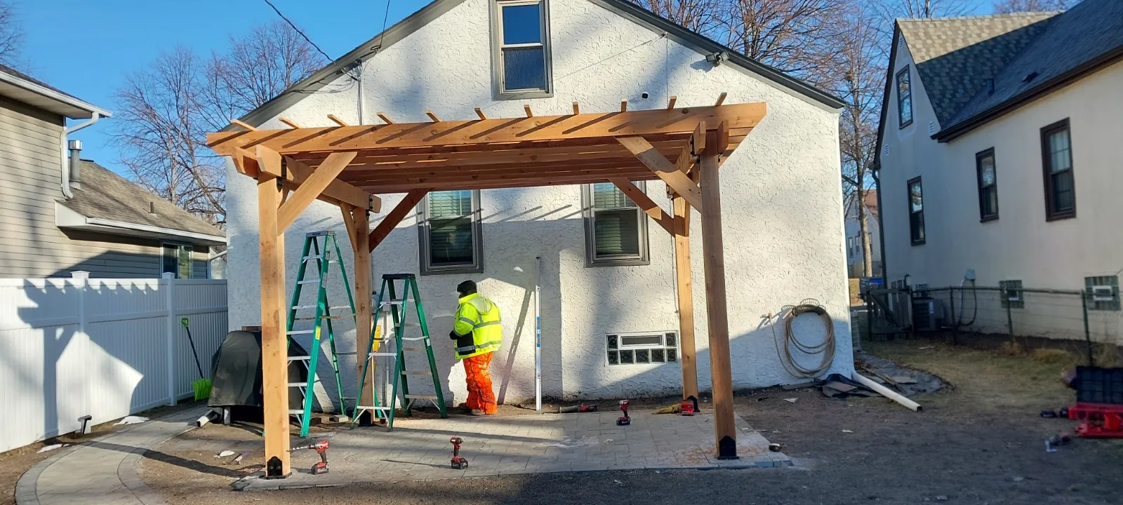 Cedar pergola frame under construction at a home in Bloomington, MN
